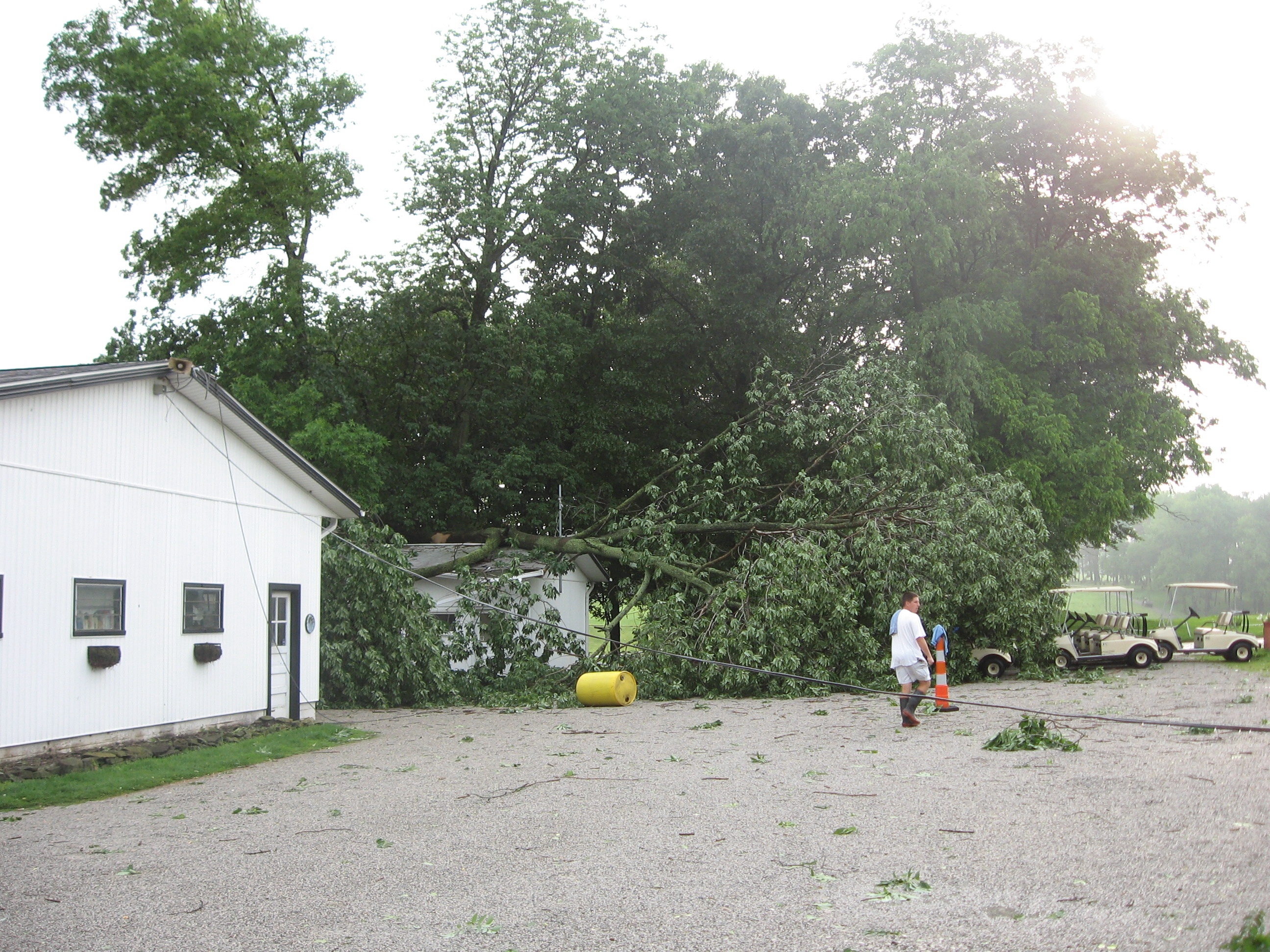 stormdamage07/Cleaningupattheoldshop.JPG